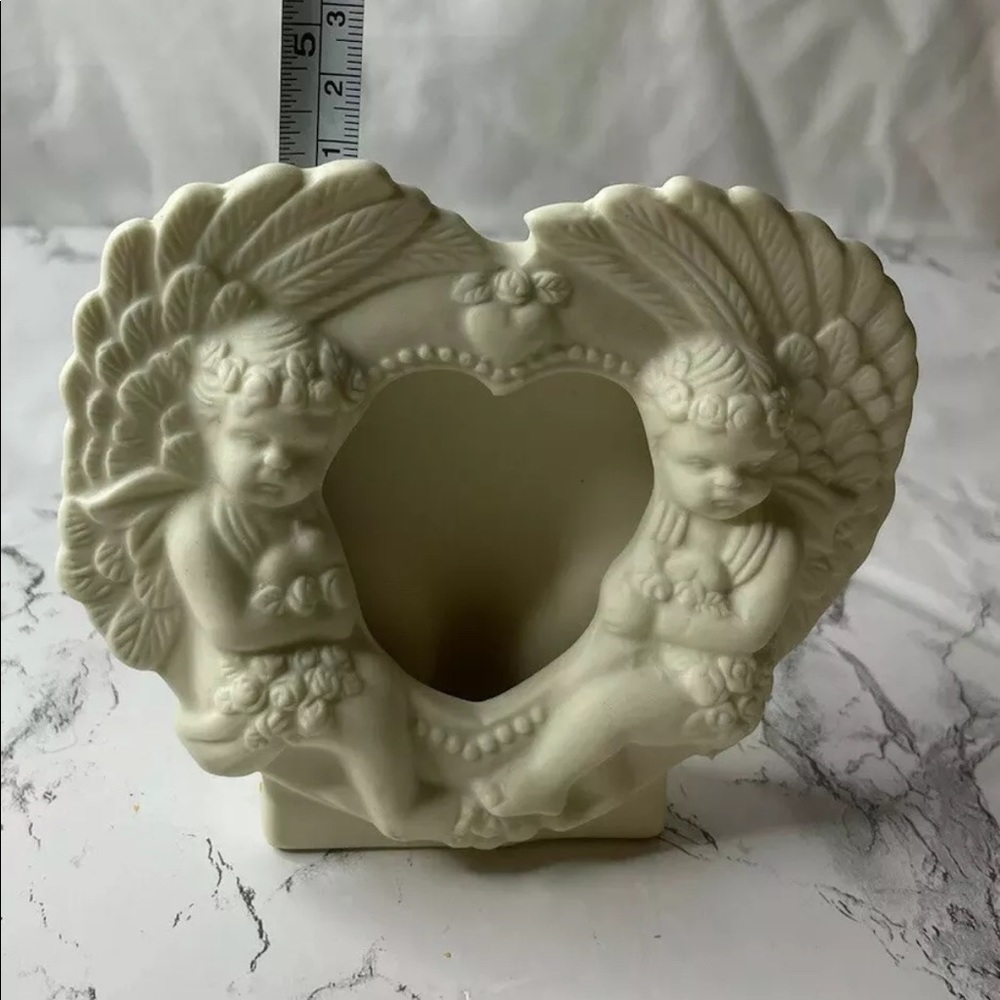Cherub photo holder ceramic.